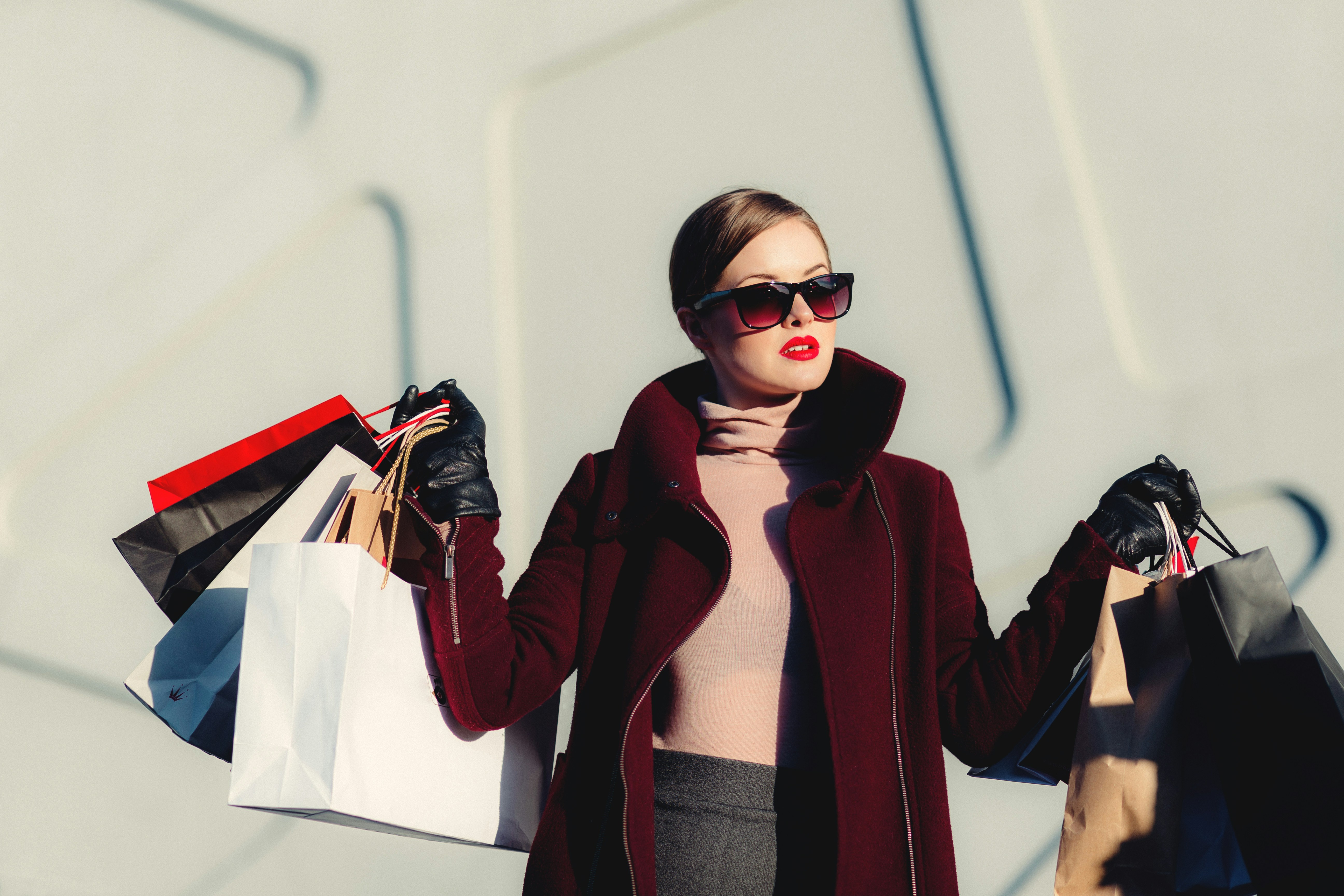 woman who has been shopping carrying lots of shopping bags
